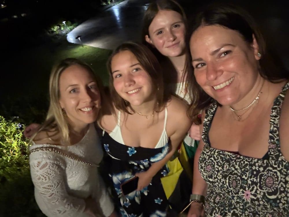 A selfie of four smiling women on a night out